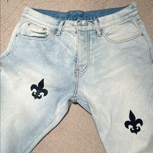 MNML Light Blue Relaxed Fit Jeans with Black Fleur-de-Lis